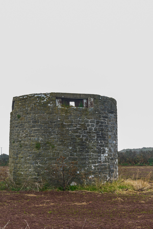 Former windmill with loopholes for anti-invasion defence. Angle, Pembrokeshire, Wales, United Kingdom.の写真素材