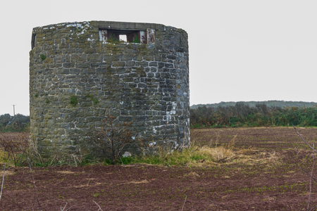 Former windmill with loopholes for anti-invasion defence. Angle, Pembrokeshire, Wales, United Kingdom.の写真素材