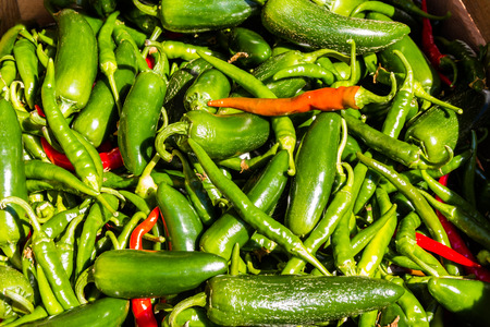 Chilli peppers in a pile making a background.の写真素材