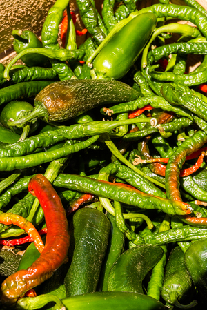 Chilli peppers in a pile making a background.の写真素材