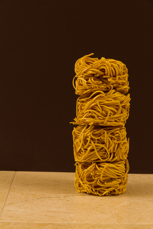 Stack of four noodle nests, copy space to left.の写真素材