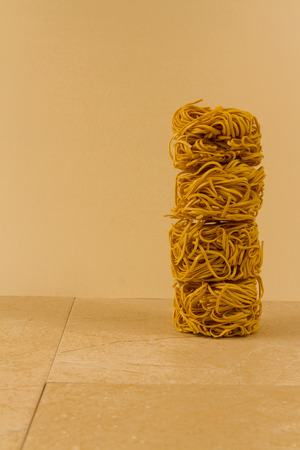 Stack of four noodle nests, copy space to left.の写真素材