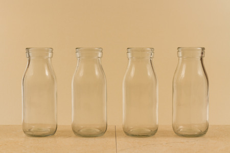 Childrenâs water drink in bottle with straw. Slices of orange, lemon and lime. Copy space on leftの写真素材