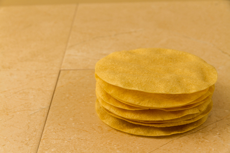 Indian poppadums stacked with copy space on left.の写真素材