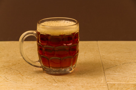 Half pint mug of English beer or ale.の写真素材