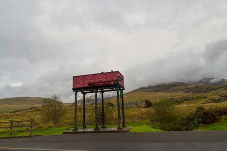 Red painted water tower for steam locomotives. Rhyd Ddu, North Wales, United Kingdom.の写真素材