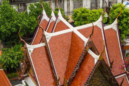 Cho Fa or Chofa finials on roof of Buddhist Temple.の写真素材
