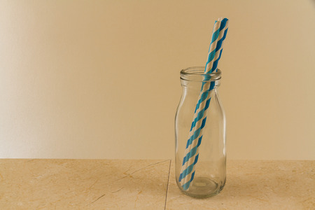 Copy space area with Glass bottle with four straws.の写真素材