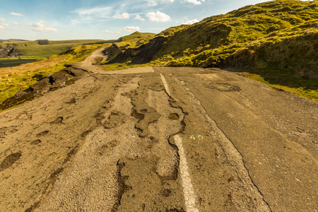 Road closed and destroyed by landslip, A625. Mam Tor, Peak District National Park, Derbyshire, England, UKの写真素材