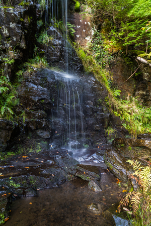 Water cascading down rocks, North Wales, UK.の写真素材