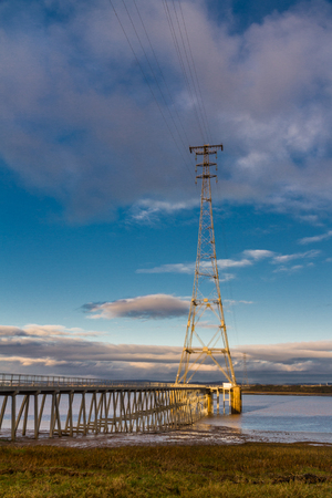 High electrical pylon next to the Severn Crossing, Aust, United Kingdom. Morning light.の写真素材
