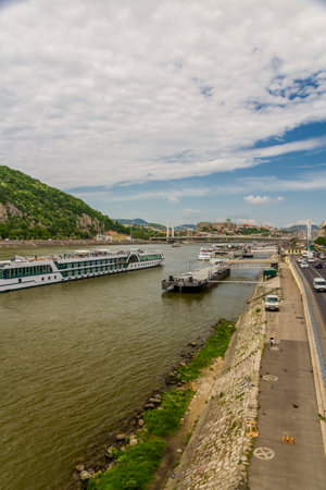 Budapest, Hungary â April 24 Bank of River Danube with boats on April 24 2018 in Budapest.のeditorial素材