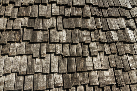 Background formed from rustic wood with bark.の写真素材
