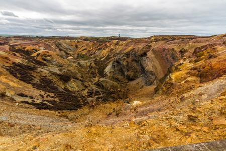 Different coloured rocks in ex copper mine area. Parys Mountain, Amlwch, Anglesey, Wales, United Kingdom.の写真素材