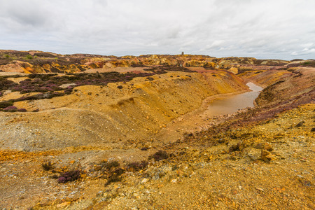 Different coloured rocks in ex copper mine area. Parys Mountain, Amlwch, Anglesey, Wales, United...