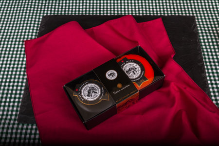 Illustrative editorial Snowdonia Cheese Company Feature Selection gift box with Black Bomber and Amber Mist cheese truckles on red napkin â Bournemouth, United Kingdom â November 30th, 2018のeditorial素材