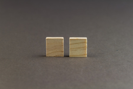 Two wood blocks against dark background, graphic resource, template, landscapeの写真素材