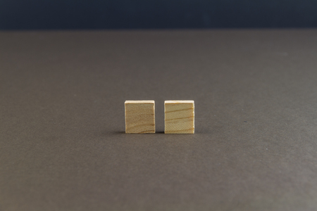 Two wood blocks against dark background, graphic resource, template, landscapeの写真素材