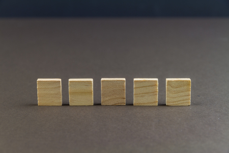 Five wood blocks against dark background, graphic resource, template, landscape, macroの写真素材