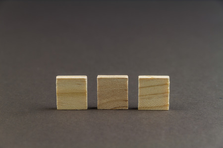 Three wood blocks against dark background, graphic resource, template, landscape, macroの写真素材