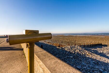 Llanfairfechan beach and coin operated telescope on November day, Conwy, North Wales.の写真素材