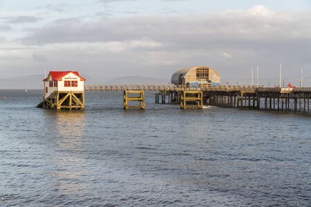 Old and new lifeboat station, The Mumbles, Swansea, Wales, afternoon lightの写真素材