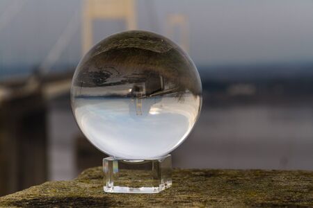 Beautiful morning light on elegant suspension bridge through crystal ball, The Severn Crossing.の写真素材