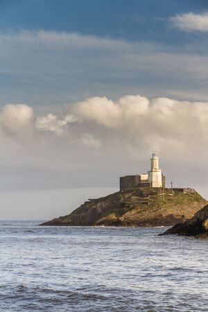 Wide angle view of the Mumbles and the lighthouse, Swansea Wales, portrait.の写真素材