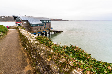 Tenby, Wales â Path and new lifeboat Station, on February 18 2019 in Walesのeditorial素材