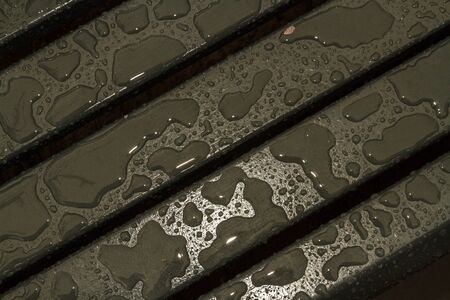 Background or texture, painted wood with recent rain droplets on them. Dark Grey, landscapeの写真素材