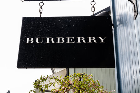 Bicester Village outlet, England , Sign or logo of  Burberry on hanging sign on April  04 2019 in UK.のeditorial素材