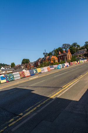 LLANGOLLEN, WALES â JULY 17 2021: Bridges Not Walls, Tapestry arts installation on bridge over River Dee by Luke Jerram to launch 2021 International Musical Eisteddfod portrait.のeditorial素材