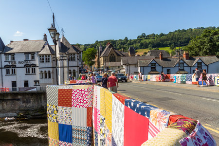 LLANGOLLEN, WALES â JULY 17 2021: Bridges Not Walls, Tapestry arts installation on bridge over River Dee by Luke Jerram to launch 2021 International Musical Eisteddfod. Wide angle landscape.のeditorial素材