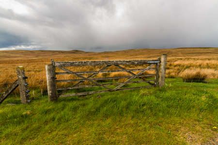 Rural gate with upland UK moorland behind, landscapeの写真素材