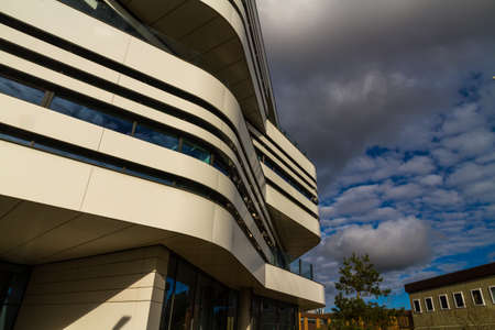 Modern building detail black and white lines and curves against winter sky, landscape.の写真素材