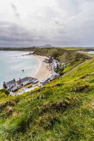 MORFA NEFYN, WALES UK â MAY 21: View over , in Porthdinllaen and the Ty Coch Inn, copyspace at top, Gwynedd, portrait, United Kingdom on May 9 2021のeditorial素材