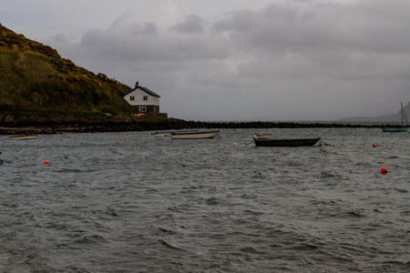 Dim light and choppy sea in harbour, landscapeの写真素材