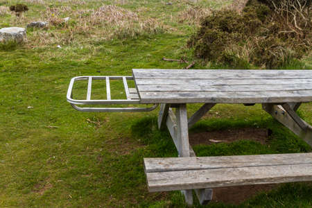Picnic bench with metal shelf to hold disposable, landscapeの写真素材