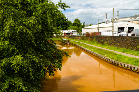 The Trent and Mersey Canal, Kidsgrove, Newcastle-under-Lyme. The water is orange because if clay deposited in the Harecastle Tunnel, landscapeの写真素材