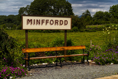 Sign for Minfford Railway Station on the Ffestiniog Railway. Penrhyndeudraeth, Eryri or Snowdonia national Park, Wales, landscape with benchの写真素材