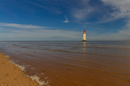 The Point of Ayr or Talacre Lighthouse is on the north coast of Wales, UK, wide angle, copyspace to leftの写真素材