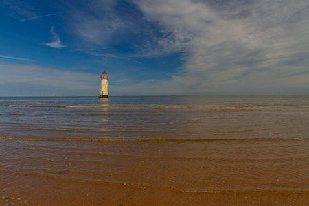 The Point of Ayr or Talacre Lighthouse is on the north coast of Wales, UK, wide angle, copyspace to rightの写真素材