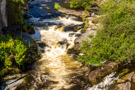 The River Dee cascading at Llangollen, Denbighshire, North Wales on a Sunny Day, landscape.の写真素材