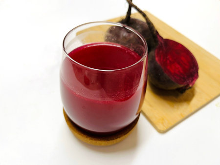 Beetroot juice in a glass on a white background, isolatedの写真素材