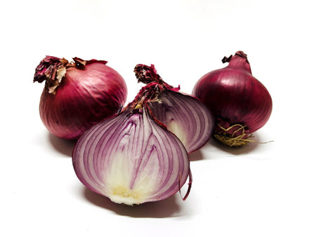 red onions isolated on white background. studio shot of red onions.の写真素材