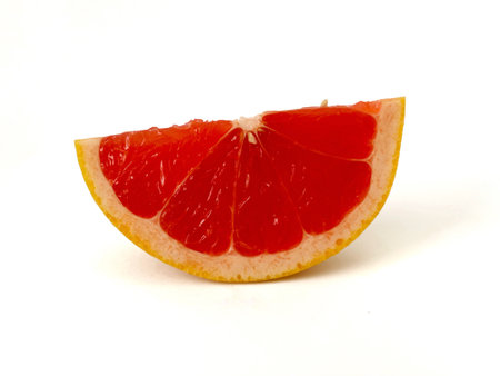 Slice of grapefruit isolated on a white background. Studio shot.の写真素材