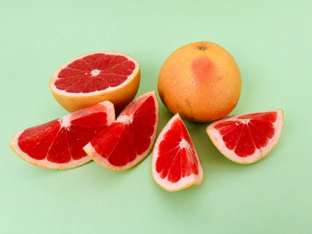 Grapefruit on a green background, close-up, verticalの写真素材