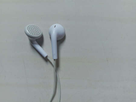 white earphones on White texture backgroundの写真素材