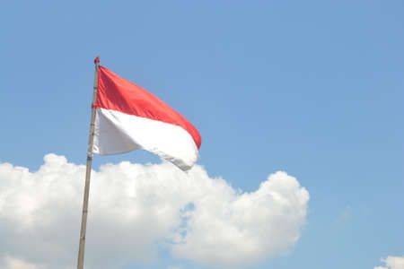 Indonesian Flag, Red and White, with blue sky background, Independece day (Hari merdeka),hero day (Hari Pahlawan)の写真素材
