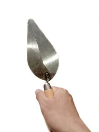 Trowel the mortar on white backgroundの写真素材